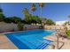 Inviting community pool with lounge chairs at 4525 N 66Th St # 70, Scottsdale, AZ 85251