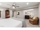Main bedroom with king bed and access to sitting area at 4525 N 66Th St # 70, Scottsdale, AZ 85251
