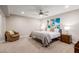 Spacious bedroom with king-size bed and sitting chair at 4525 N 66Th St # 70, Scottsdale, AZ 85251