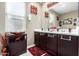 Elegant bathroom with double vanity, soaking tub, and separate shower at 20051 N Herbert Ave, Maricopa, AZ 85138