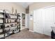 Home office with built-in shelving and closet at 20051 N Herbert Ave, Maricopa, AZ 85138