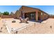 Spacious backyard with patio and fire pit at 20051 N Herbert Ave, Maricopa, AZ 85138