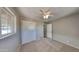 Bedroom with double door closet and window at 5480 E Boston St, Mesa, AZ 85205