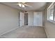 Spacious bedroom with carpet and ceiling fan at 5480 E Boston St, Mesa, AZ 85205