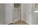 Shower stall with grab bar and tiled walls at 5480 E Boston St, Mesa, AZ 85205