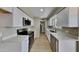 Updated kitchen featuring white cabinets and quartz countertops at 5480 E Boston St, Mesa, AZ 85205