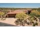 Home with desert landscape and mountain views at 9975 E Broken Spur Dr, Scottsdale, AZ 85262