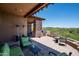 Large patio with seating, grill, and mountain views at 9975 E Broken Spur Dr, Scottsdale, AZ 85262