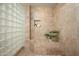 Bathroom with a shower and glass block wall at 9975 E Broken Spur Dr, Scottsdale, AZ 85262