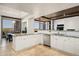 Open kitchen with granite countertops, island, and views at 9975 E Broken Spur Dr, Scottsdale, AZ 85262