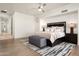 Main bedroom with hardwood floors, and large windows at 9975 E Broken Spur Dr, Scottsdale, AZ 85262