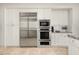 Modern kitchen features stainless steel appliances and granite countertops at 9975 E Broken Spur Dr, Scottsdale, AZ 85262