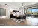 Spacious bedroom with hardwood floors and access to patio at 9975 E Broken Spur Dr, Scottsdale, AZ 85262