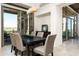 Elegant dining area with a large table and access to patio at 9975 E Broken Spur Dr, Scottsdale, AZ 85262