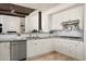 Spacious kitchen with granite countertops, white cabinets, and a large island at 9975 E Broken Spur Dr, Scottsdale, AZ 85262