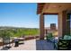 Covered patio with seating area and mountain views at 9975 E Broken Spur Dr, Scottsdale, AZ 85262