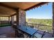 Patio with dining area and putting green views at 9975 E Broken Spur Dr, Scottsdale, AZ 85262