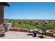 Outdoor patio with seating area and mountain views at 9975 E Broken Spur Dr, Scottsdale, AZ 85262