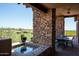 Spacious patio with seating and hot tub at 9975 E Broken Spur Dr, Scottsdale, AZ 85262