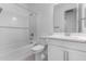 Clean bathroom with single vanity, bathtub and shower at 16911 W Siesta Way, Goodyear, AZ 85338