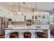 Modern kitchen with granite island, white cabinets, and pendant lighting at 9768 E Balancing Rock Rd, Scottsdale, AZ 85262