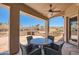 Peaceful patio with outdoor fireplace and seating area at 9768 E Balancing Rock Rd, Scottsdale, AZ 85262