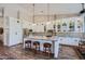 Modern kitchen with white cabinets, granite counters, and large island at 9768 E Balancing Rock Rd, Scottsdale, AZ 85262
