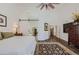 Primary bedroom with king bed, barn door, and access to the ensuite bathroom at 9768 E Balancing Rock Rd, Scottsdale, AZ 85262