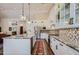 Modern kitchen with white cabinets and granite countertops at 9768 E Balancing Rock Rd, Scottsdale, AZ 85262