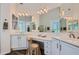 Elegant bathroom with dual vanity, large mirrors, and updated fixtures at 9768 E Balancing Rock Rd, Scottsdale, AZ 85262