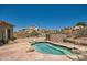 Relaxing kidney-shaped pool with flagstone patio at 9768 E Balancing Rock Rd, Scottsdale, AZ 85262