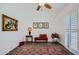 Charming sitting area featuring a red bench and a ceiling fan at 9768 E Balancing Rock Rd, Scottsdale, AZ 85262
