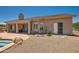 Tan stucco house with covered patio at 9768 E Balancing Rock Rd, Scottsdale, AZ 85262
