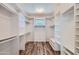 Large walk-in closet with ample shelving and hanging space at 9768 E Balancing Rock Rd, Scottsdale, AZ 85262