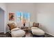 Relaxing sitting room with two armchairs and ottomans at 9768 E Balancing Rock Rd, Scottsdale, AZ 85262