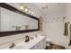 Double vanity bathroom with large mirror and shower/tub at 9768 E Balancing Rock Rd, Scottsdale, AZ 85262