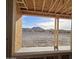 Under-construction covered patio with a view of the surrounding desert at 1973 W Brooke Ln, Queen Creek, AZ 85144