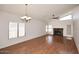 Spacious living room with wood floors, fireplace, and large windows at 5101 E Terry Dr, Scottsdale, AZ 85254