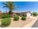 Tan house with a white pergola, palm trees, and well-manicured landscaping at 2550 S Ellsworth Rd # 366, Mesa, AZ 85209