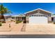 Single-story home with attached garage and desert landscaping at 2550 S Ellsworth Rd # 366, Mesa, AZ 85209