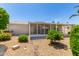 Covered patio, gravel yard, and mature shrubs at 2550 S Ellsworth Rd # 366, Mesa, AZ 85209