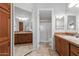 Double sink bathroom with a large mirror, good lighting, and a walk-in shower at 2550 S Ellsworth Rd # 366, Mesa, AZ 85209