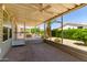 Covered patio with screened enclosure, ceiling fan, and backyard view at 2550 S Ellsworth Rd # 366, Mesa, AZ 85209