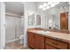 Clean bathroom with updated vanity, large mirror, and shower/tub combo at 2550 S Ellsworth Rd # 366, Mesa, AZ 85209