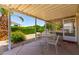 Relaxing covered patio with table and chairs, perfect for outdoor dining at 2550 S Ellsworth Rd # 366, Mesa, AZ 85209
