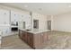 Large kitchen island with white cabinets and quartz countertops at 1973 W Brooke Ln, Queen Creek, AZ 85144