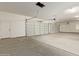 Large three-car garage with high ceilings and ample storage at 1973 W Brooke Ln, Queen Creek, AZ 85144