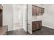 Laundry room with shaker cabinets, hexagon tile, and access to other rooms at 1973 W Brooke Ln, Queen Creek, AZ 85144