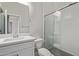 Modern bathroom with a white vanity, shower, and hexagon tile floor at 1973 W Brooke Ln, Queen Creek, AZ 85144