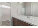 Bathroom with brown vanity, white countertop and a bathtub at 1973 W Brooke Ln, Queen Creek, AZ 85144